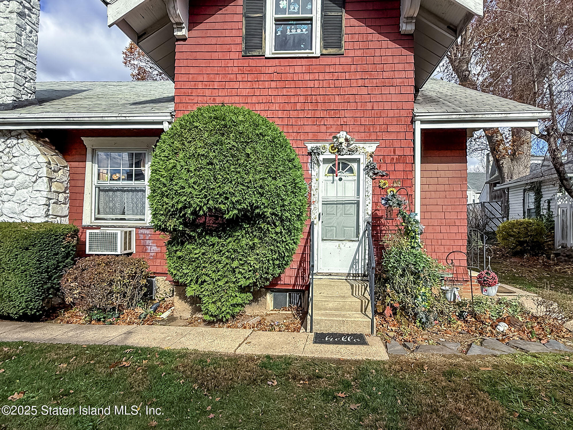 151 Clinton B Fiske Avenue Staten Island, NY 10314 - Photo 19 of 33 a front view of a house with a yard and plants