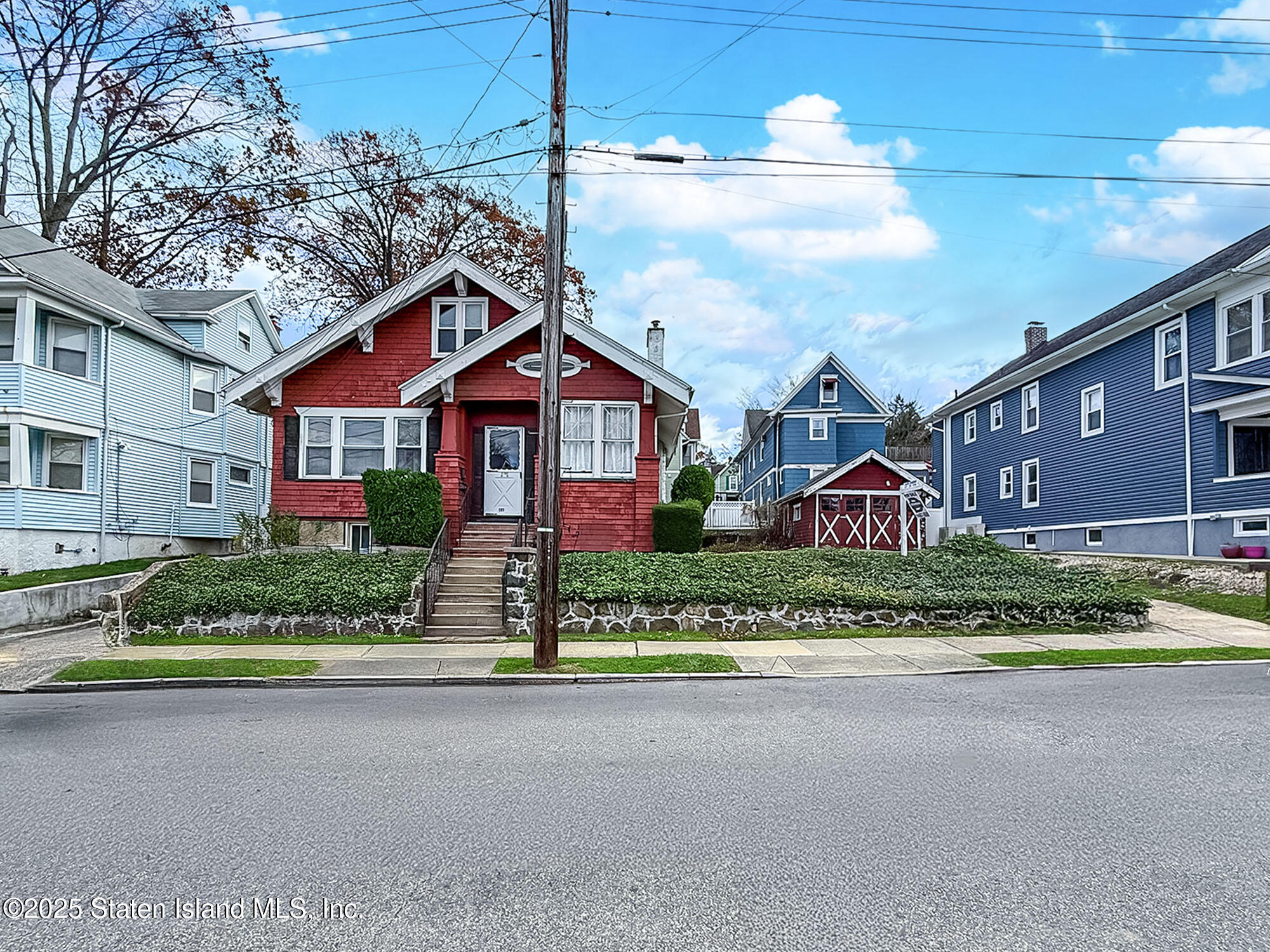 151 Clinton B Fiske Avenue Staten Island, NY 10314 - Photo 32 of 33 a front view of a house with a yard