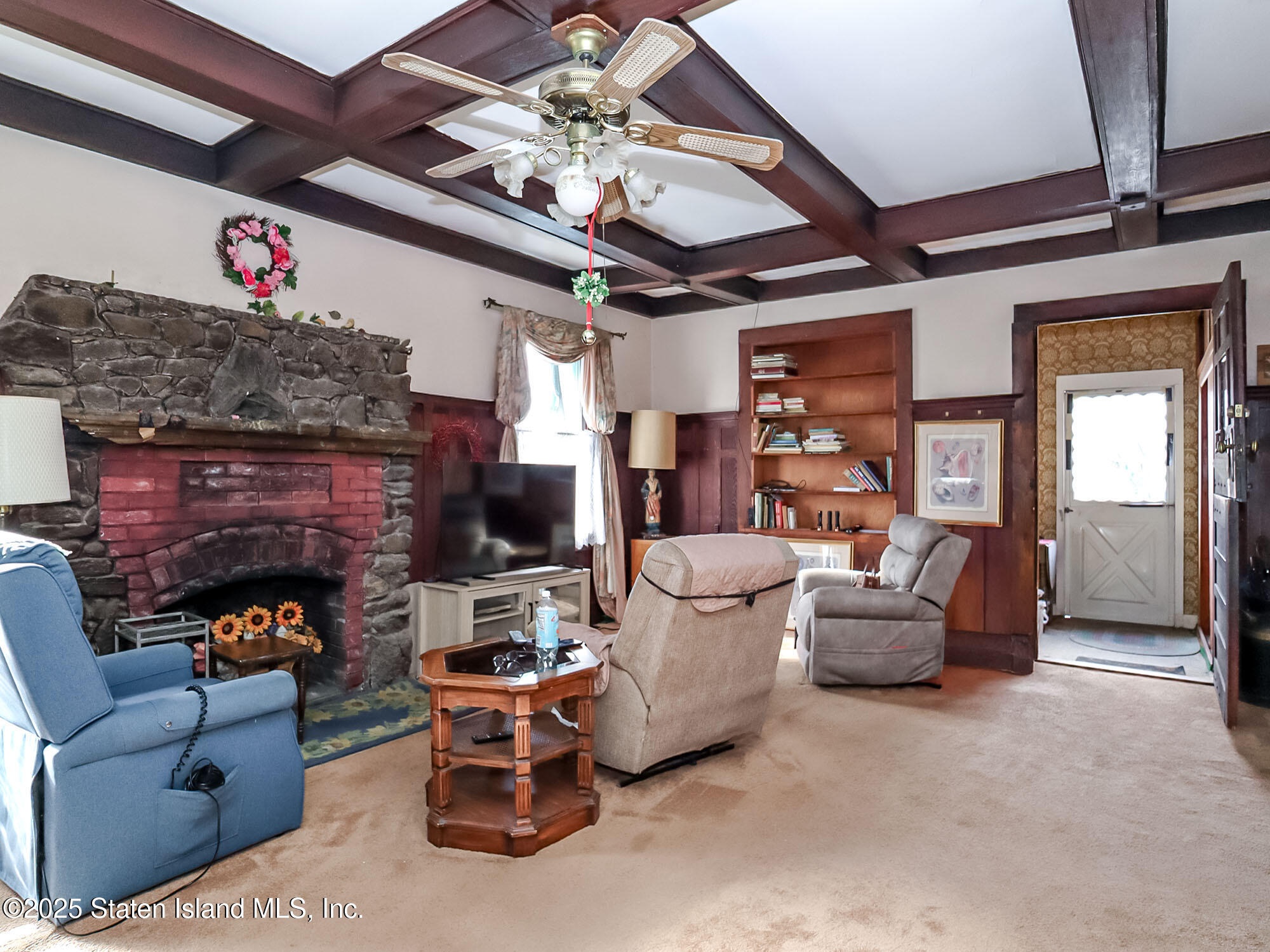 151 Clinton B Fiske Avenue Staten Island, NY 10314 - Photo 9 of 33 a living room with furniture and a fireplace