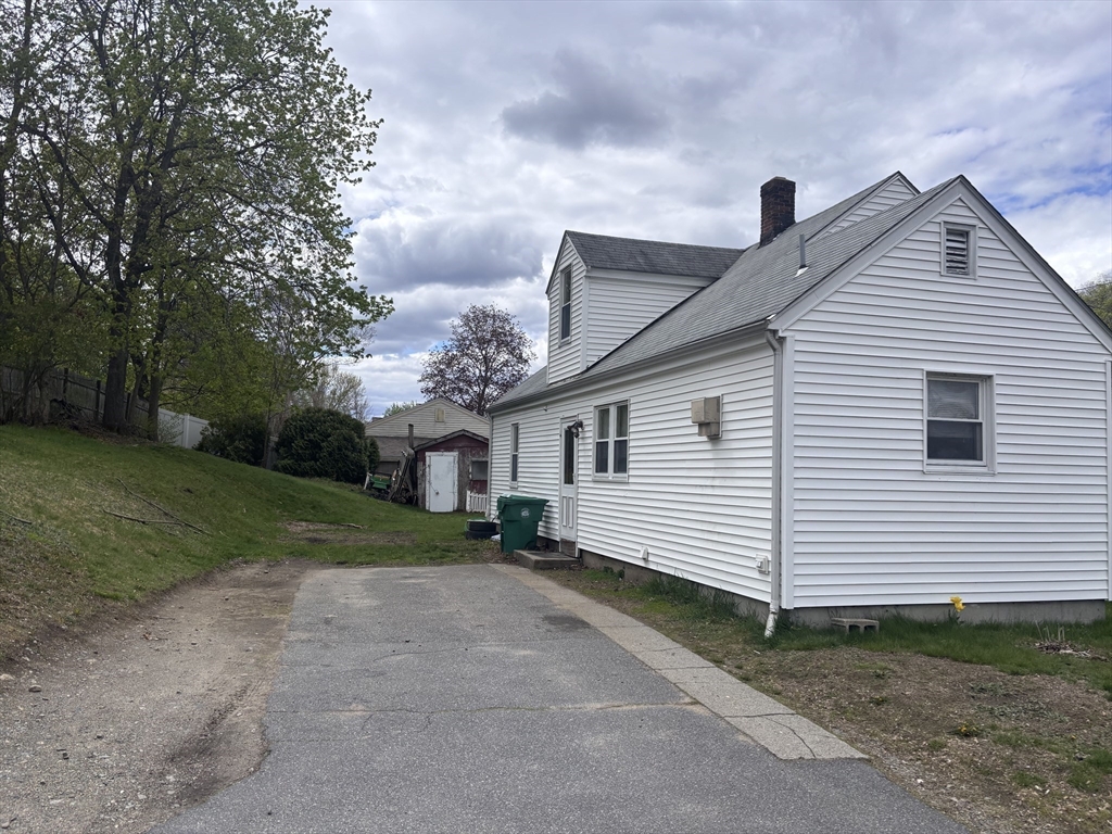 349 Oak Street Clinton, MA 01510 - Photo 2 of 9 a view of a house with a yard