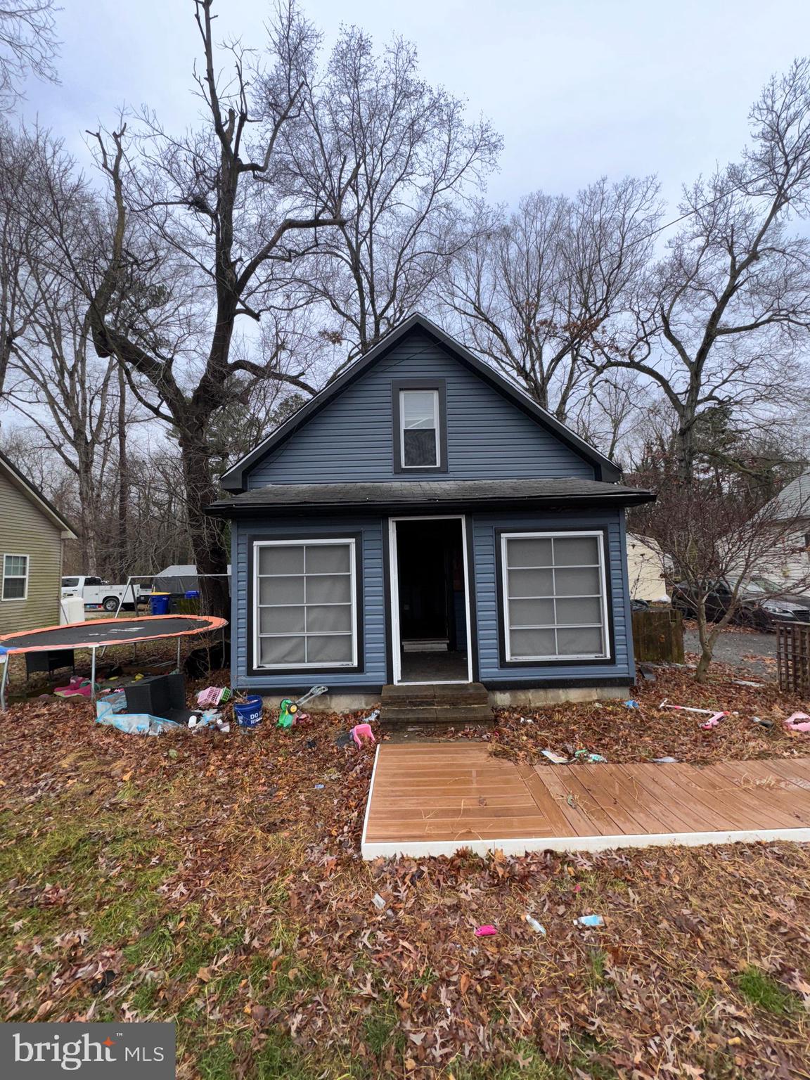 491 Broad Street Houston, DE 19954 - Photo 1 of 22 a front view of a house with a yard and garage