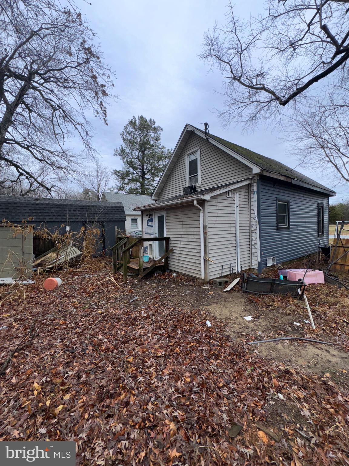 491 Broad Street Houston, DE 19954 - Photo 20 of 22 a view of a house with a yard and sitting area