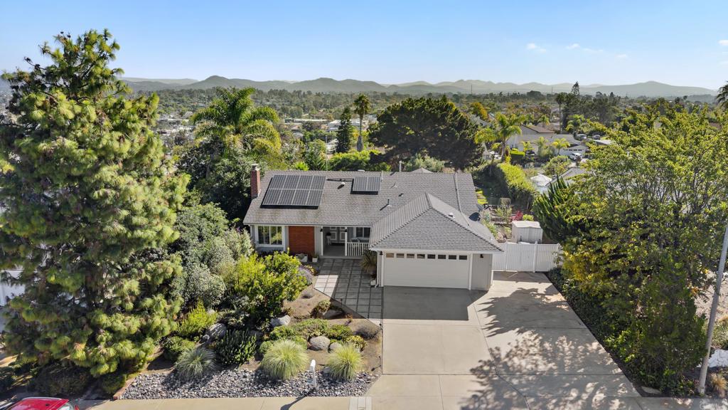an aerial view of a house with a garden