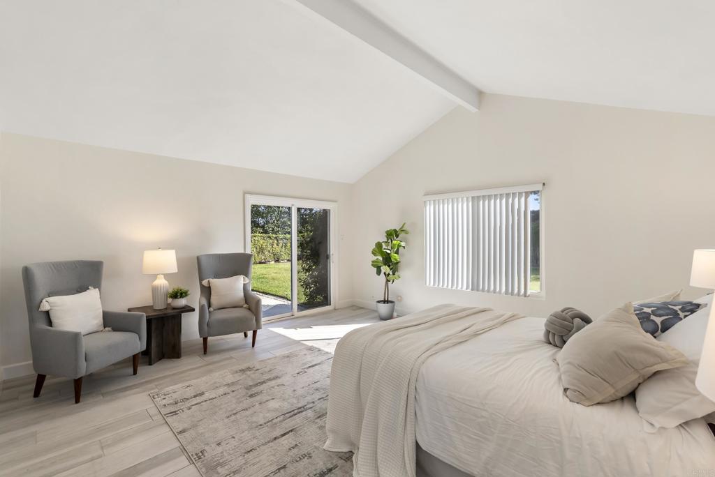 147 Witham Road Encinitas, CA 92024 - Photo 28 of 47 a bedroom with a bed and wooden floor