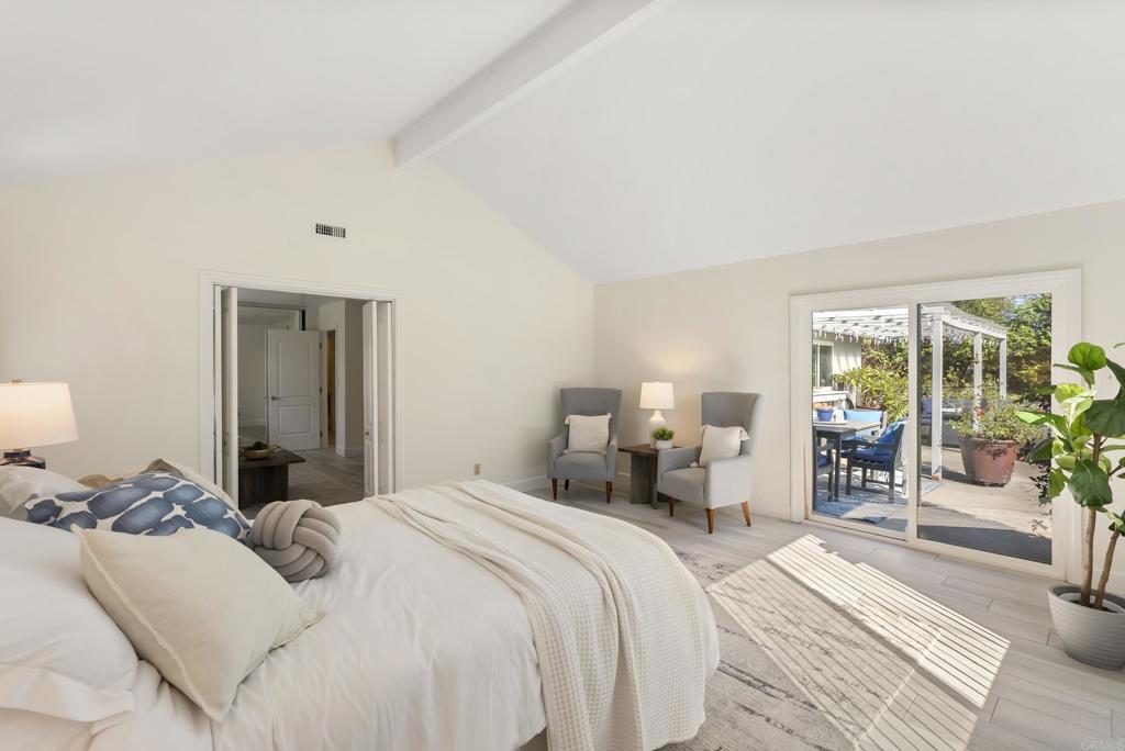 147 Witham Road Encinitas, CA 92024 - Photo 29 of 47 a bedroom with a large bed and large windows