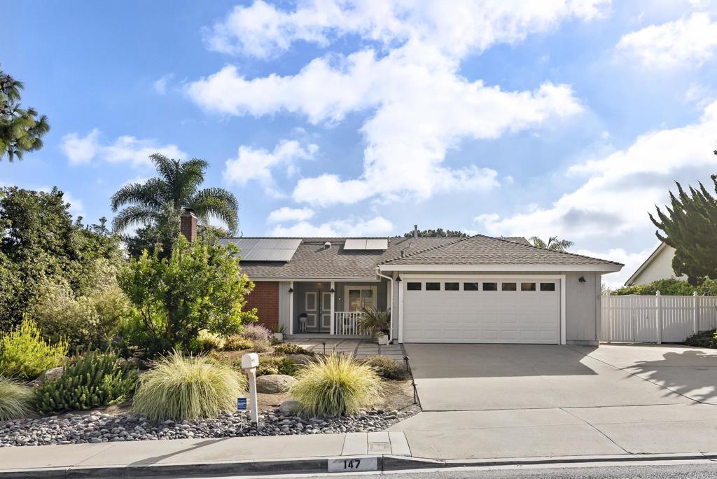 147 Witham Road Encinitas, CA 92024 - Photo 3 of 47 a front view of a house with a garden