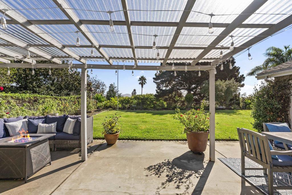 147 Witham Road Encinitas, CA 92024 - Photo 31 of 47 a patio with garden area and outdoor seating