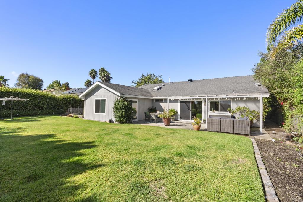147 Witham Road Encinitas, CA 92024 - Photo 36 of 47 a front view of a house with a garden and porch