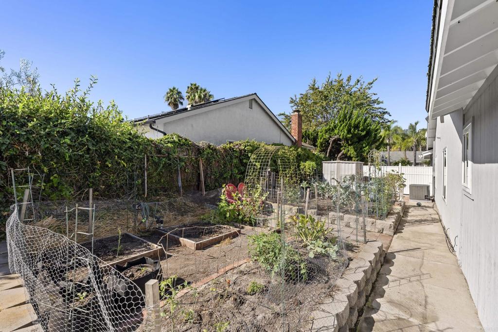 147 Witham Road Encinitas, CA 92024 - Photo 39 of 47 a view of a chair and table in backyard