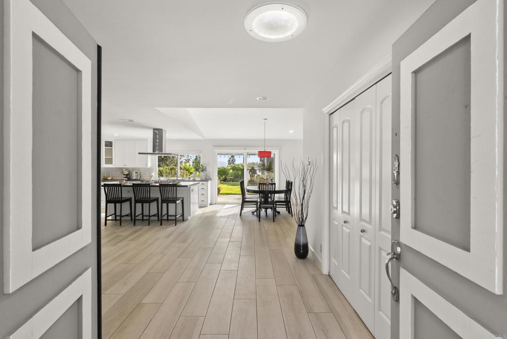 147 Witham Road Encinitas, CA 92024 - Photo 8 of 47 a view of a room with wooden floor furniture and windows