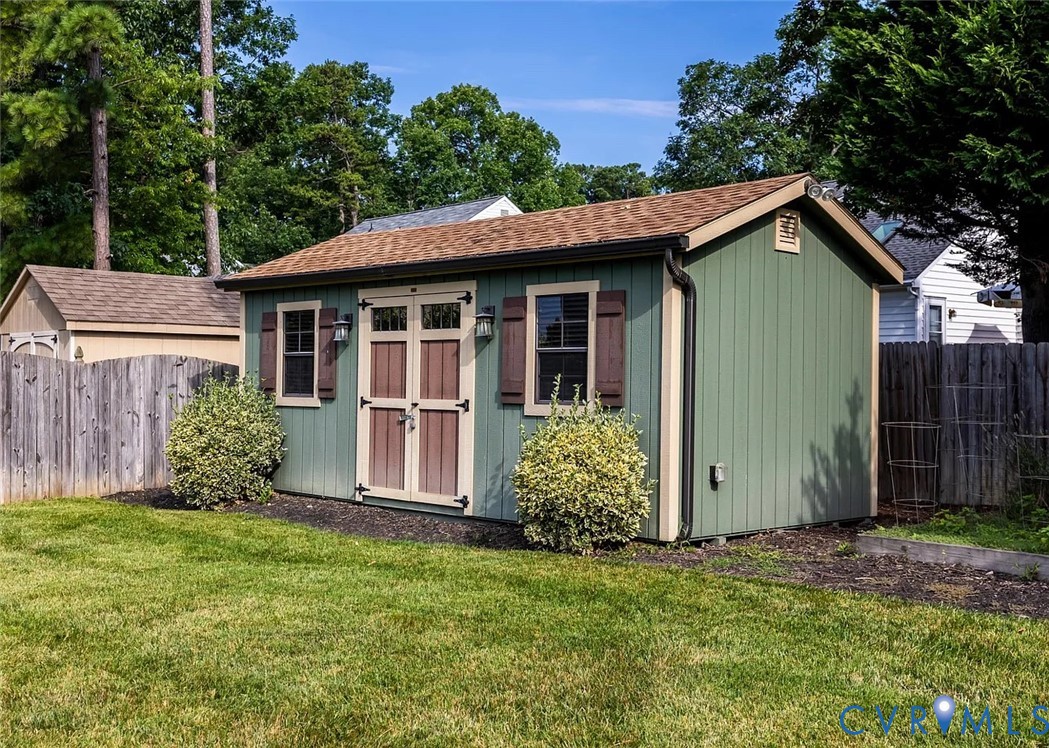 11902 Sunrise Road Henrico, VA 23233 - Photo 5 of 30 Green-sided storage shed with wood-finish double d
