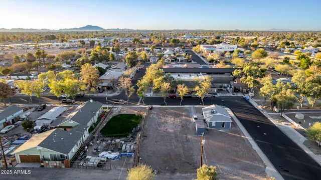 an aerial view of residential house with parking