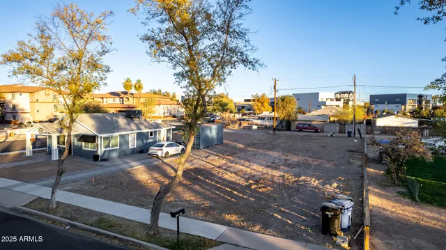 a view of a park with sitting area