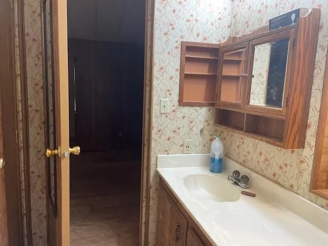 a bathroom with a toilet and a shower curtain