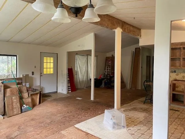 a view of a livingroom with furniture and windows