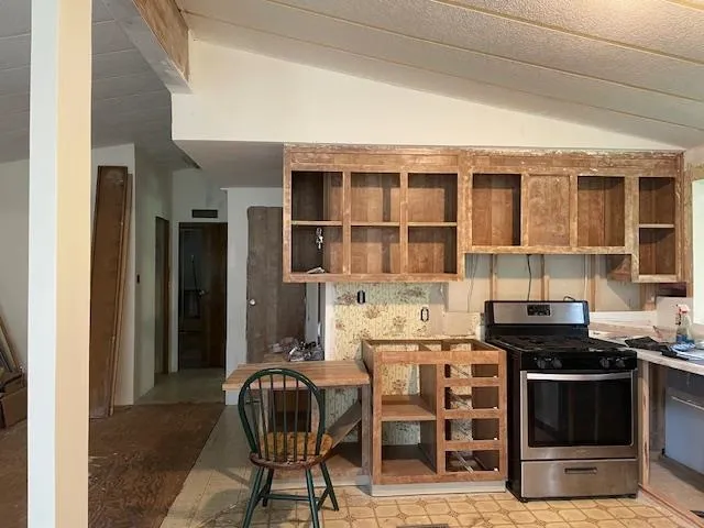 a kitchen with a stove and a cabinets