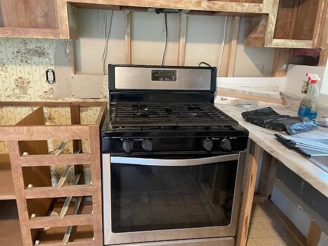 a close view of a stove top oven sitting inside of a kitchen
