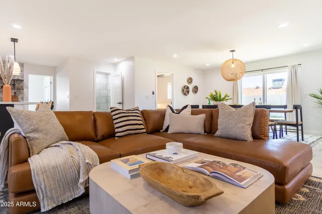 a dining room with furniture and wooden floor