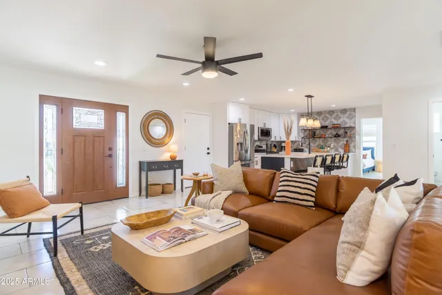 a view of a dining room with furniture and window