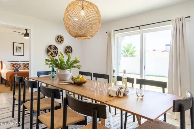 a kitchen with stainless steel appliances a stove a sink a microwave a refrigerator and cabinets