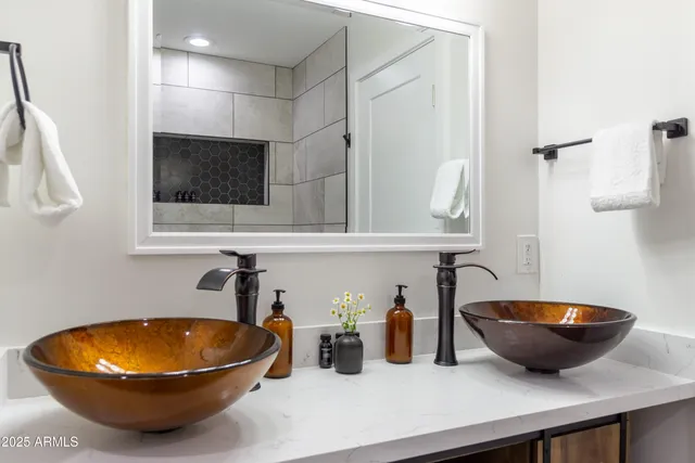 a bedroom with a bed and ceiling fan