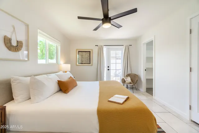 a bedroom with a bed and a table in it