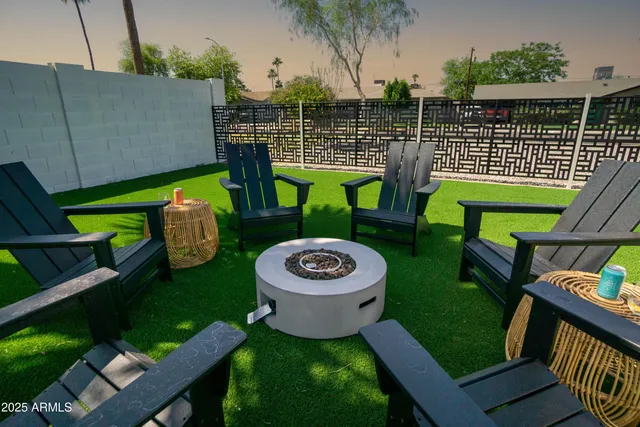 a kitchen with kitchen island granite countertop lots of counter top space and stainless steel appliances