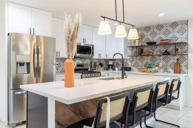 a large bedroom with a bed and window