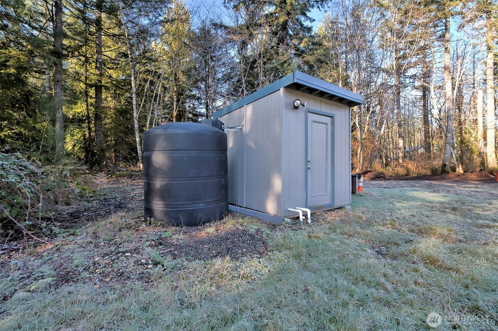 660 Southeast Cook Plant Farm Road Shelton, WA 98584 - Photo 5 of 27 a view of barn with a small yard and large trees