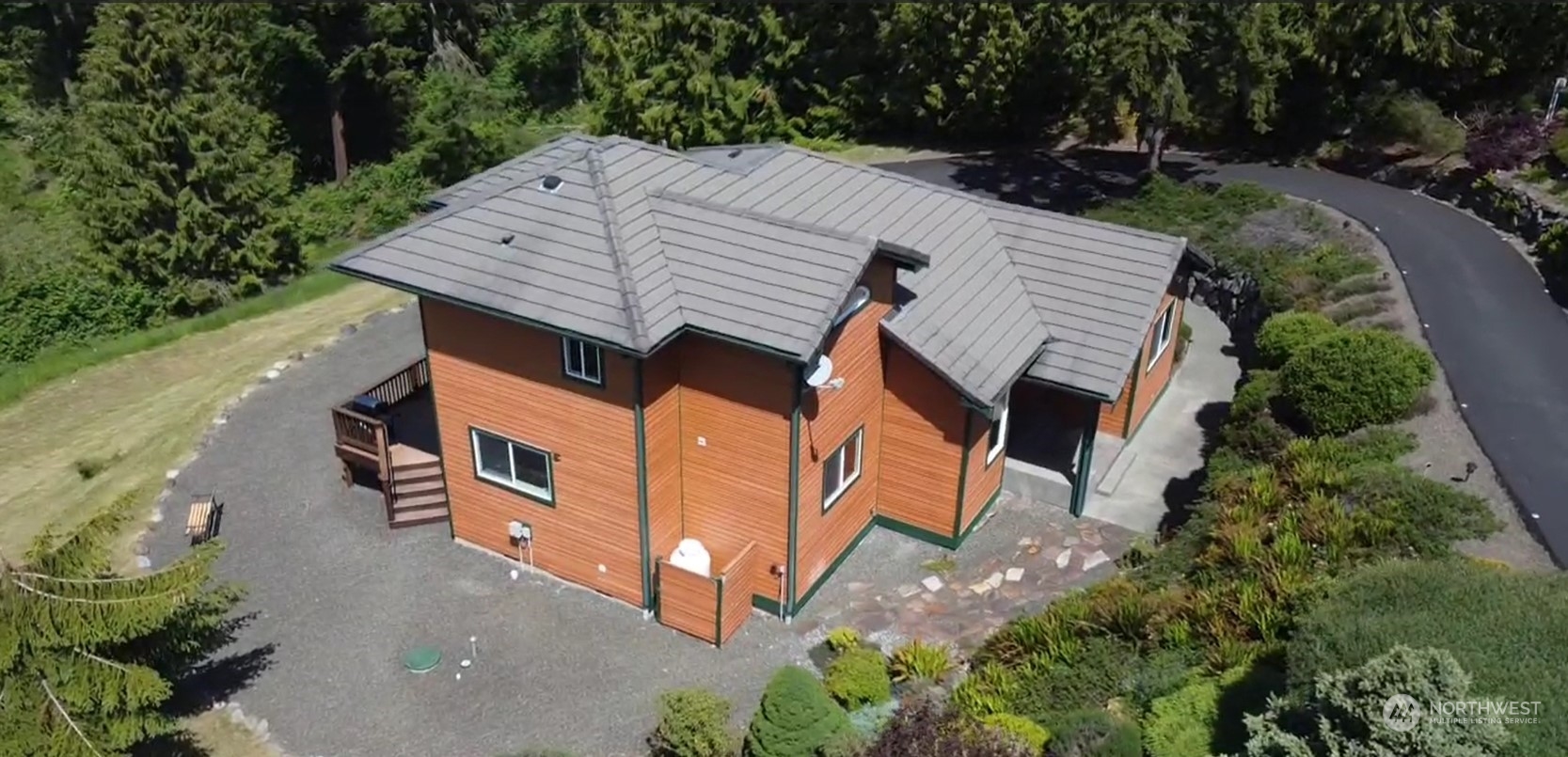 522 Fox Hollow Road Sequim, WA 98382 - Photo 3 of 40 an aerial view of a house with backyard and trees