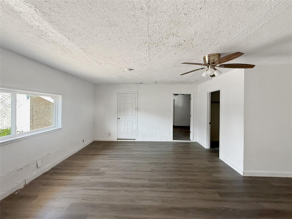 3549 Rio Grande Circle Dallas, TX 75233 - Photo 19 of 23 wooden floor in an empty room with a window