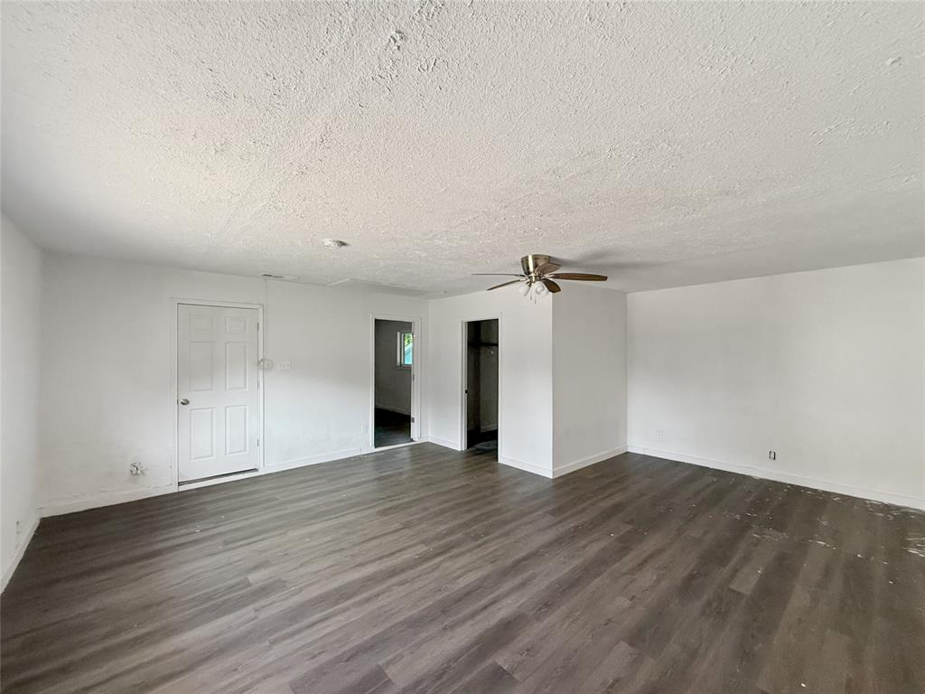 3549 Rio Grande Circle Dallas, TX 75233 - Photo 20 of 23 a view of a big room with wooden floor and windows