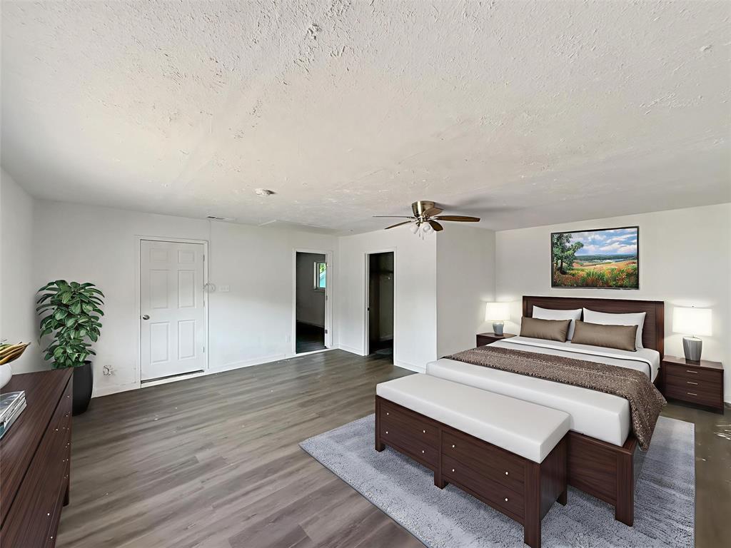 3549 Rio Grande Circle Dallas, TX 75233 - Photo 2 of 23 a bedroom with a bed and a potted plant