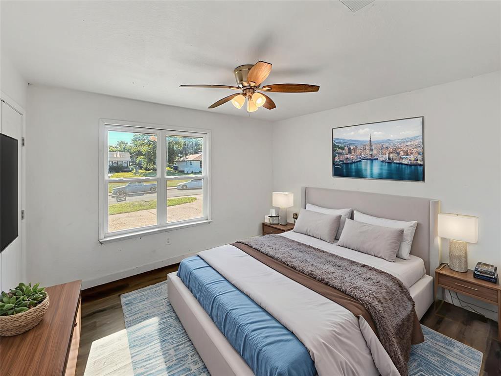 3549 Rio Grande Circle Dallas, TX 75233 - Photo 3 of 23 a bedroom with bed and a chandelier