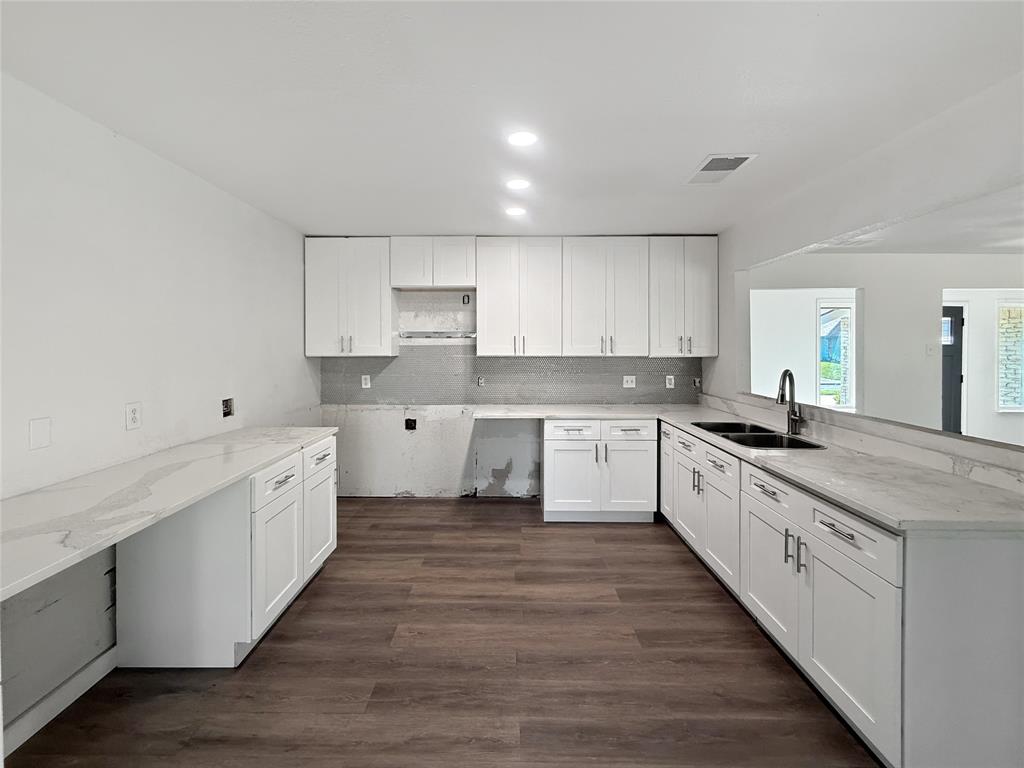 3549 Rio Grande Circle Dallas, TX 75233 - Photo 5 of 23 a large kitchen with cabinets stainless steel appliances a sink and a window