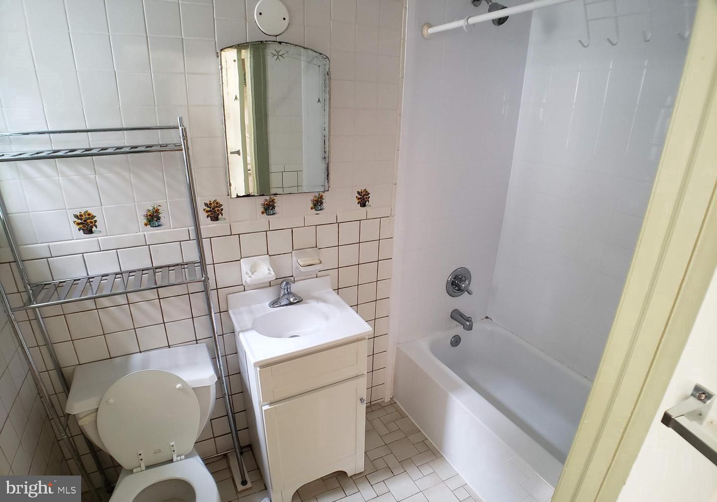408 South 45th Street, Unit 2F Philadelphia, PA 19104 - Photo 6 of 6 a bathroom with a sink toilet and shower