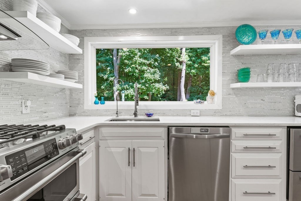 100 Circle Drive Wrentham, MA 02093 - Photo 11 of 42 a kitchen with a sink stove top oven and cabinets