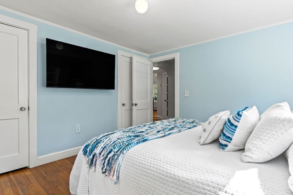 100 Circle Drive Wrentham, MA 02093 - Photo 19 of 42 a bedroom with a bed and a flat screen tv