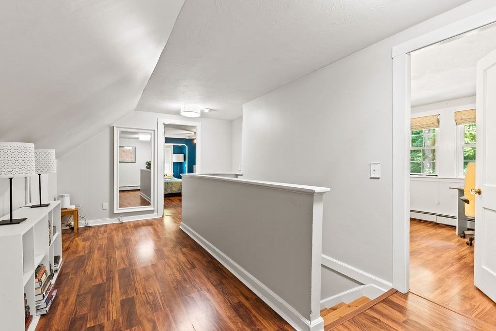 100 Circle Drive Wrentham, MA 02093 - Photo 23 of 42 a view of a room with wooden floor and a kitchen