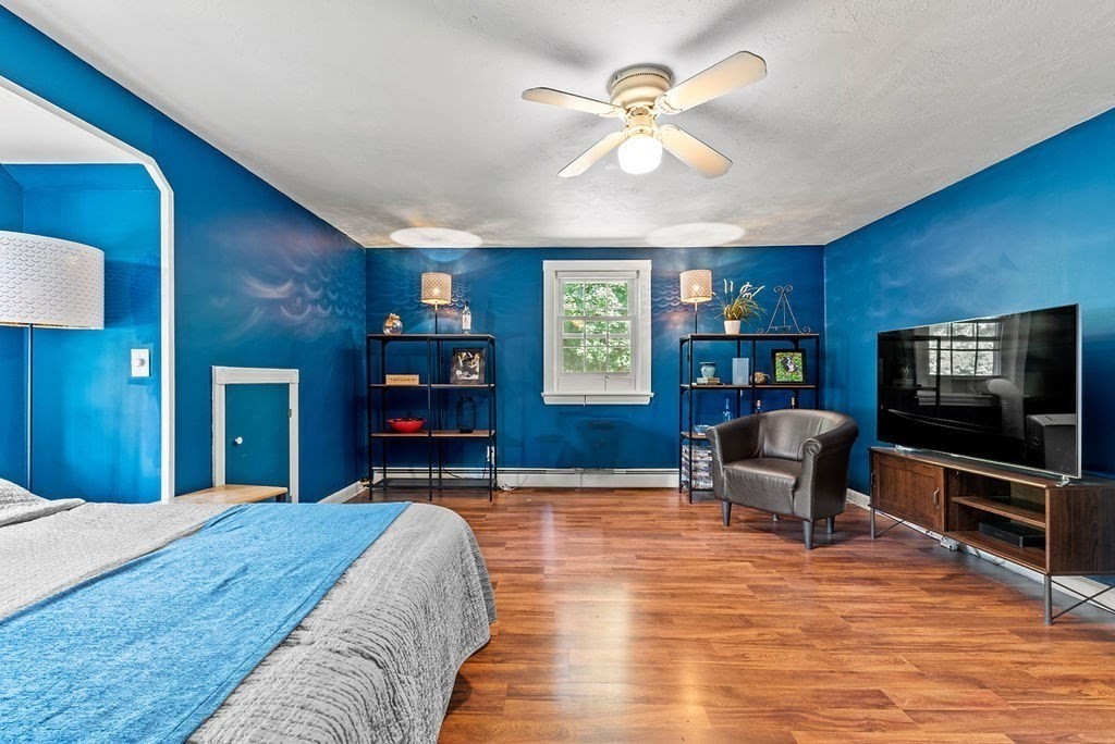 100 Circle Drive Wrentham, MA 02093 - Photo 24 of 42 a bedroom with furniture and a flat screen tv