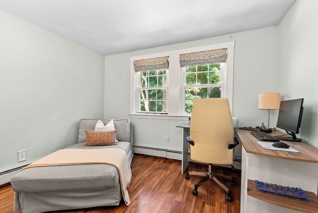 100 Circle Drive Wrentham, MA 02093 - Photo 28 of 42 a bedroom with a bed and wooden floor