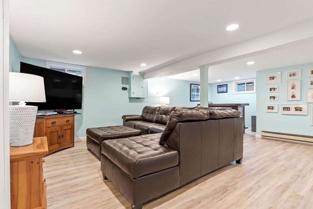 100 Circle Drive Wrentham, MA 02093 - Photo 30 of 42 a living room with furniture and a flat screen tv