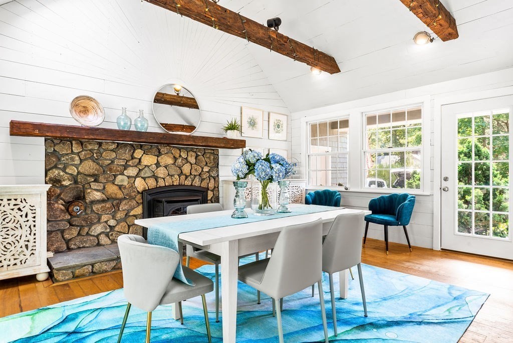 100 Circle Drive Wrentham, MA 02093 - Photo 5 of 42 a dining room with furniture a chandelier and wooden floor
