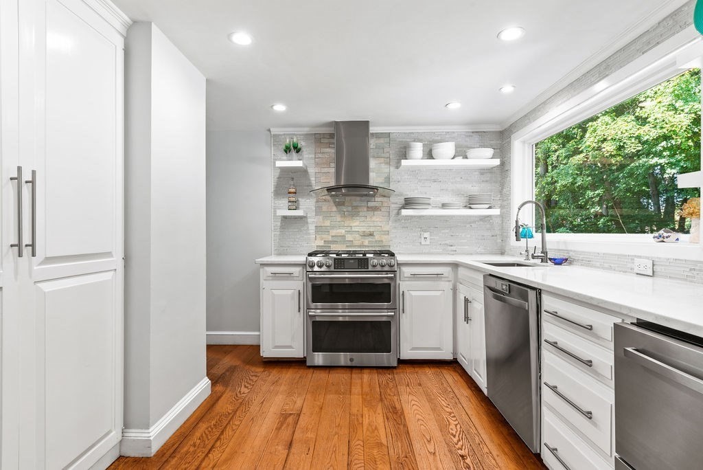 100 Circle Drive Wrentham, MA 02093 - Photo 9 of 42 a kitchen with a stove top oven and sink