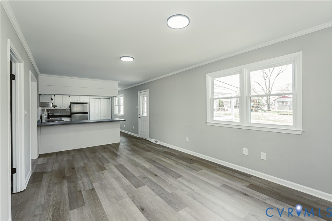 15412 Exter Mill Road Chesterfield, VA 23838 - Photo 32 of 66 Unfurnished living room with crown molding and dar