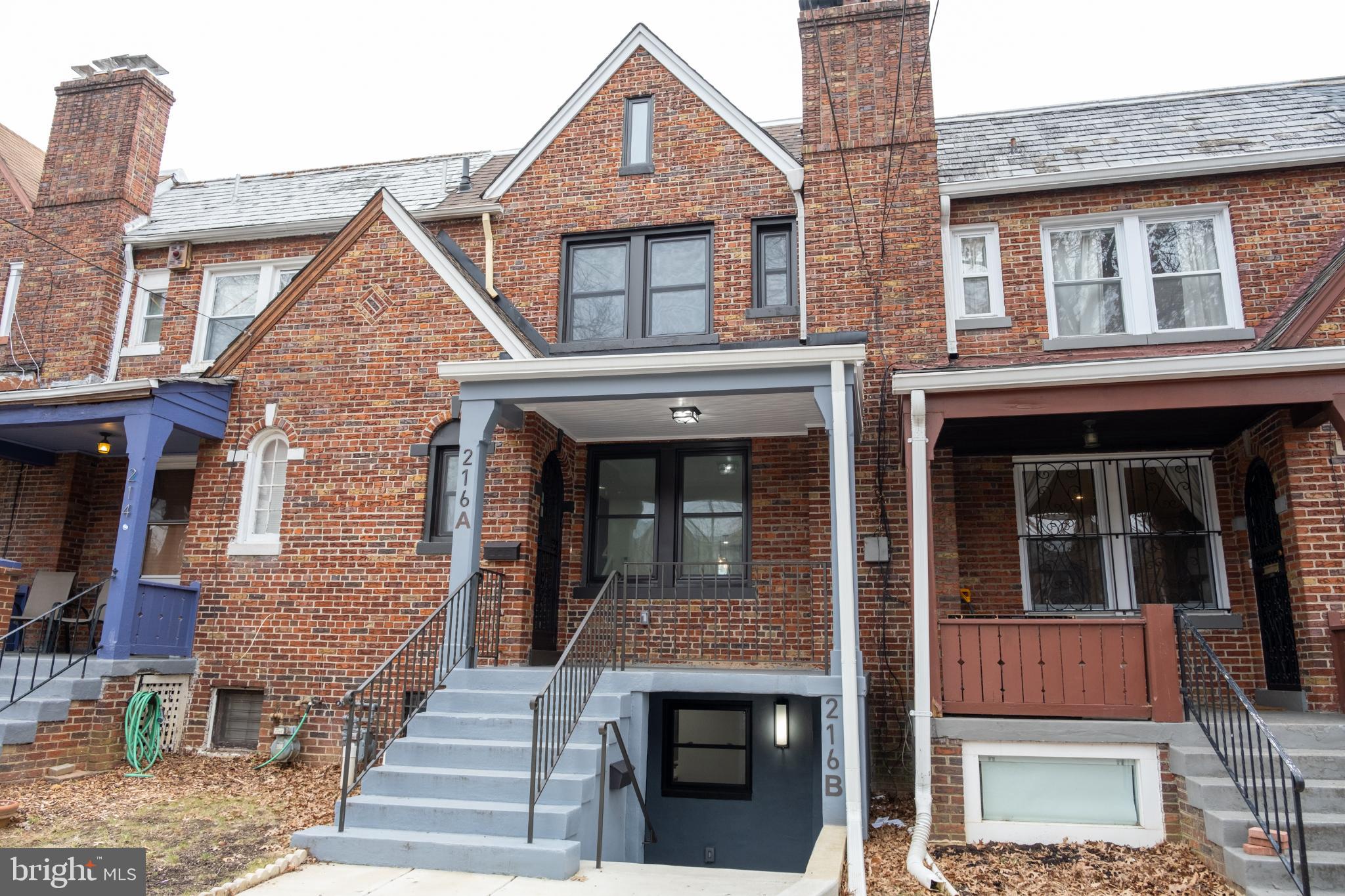 a front view of a house with glass windows