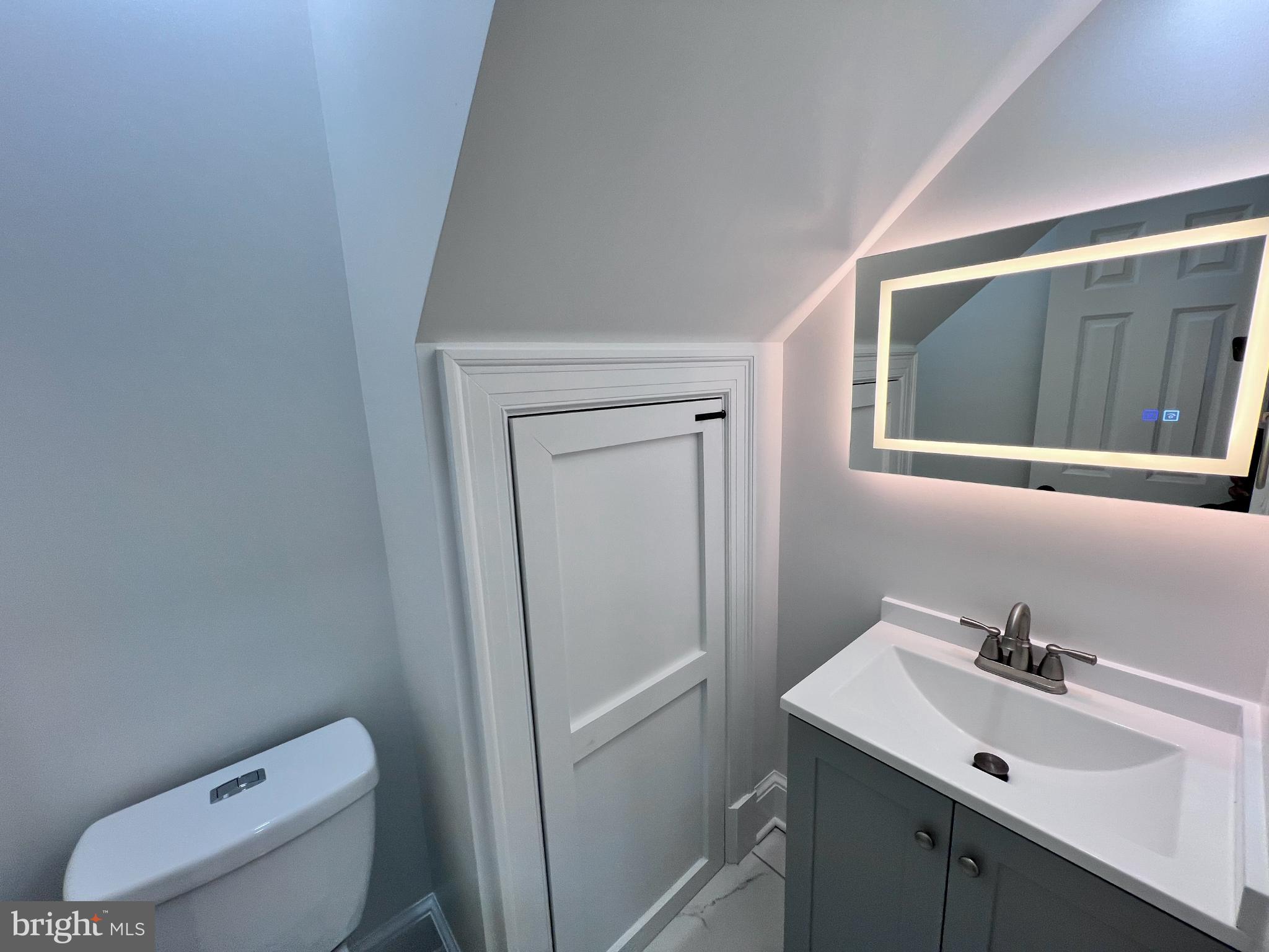 216 Jefferson Street Northwest, Unit A Washington, DC 20011 - Photo 19 of 32 a bathroom with a sink toilet and vanity