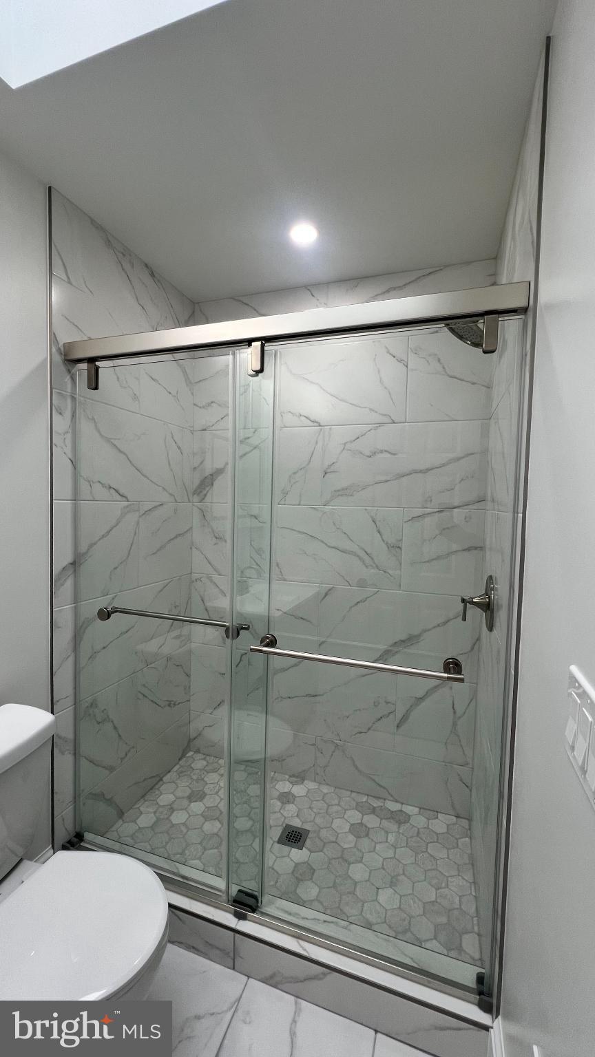 216 Jefferson Street Northwest, Unit A Washington, DC 20011 - Photo 20 of 32 a bathroom with a toilet and a shower
