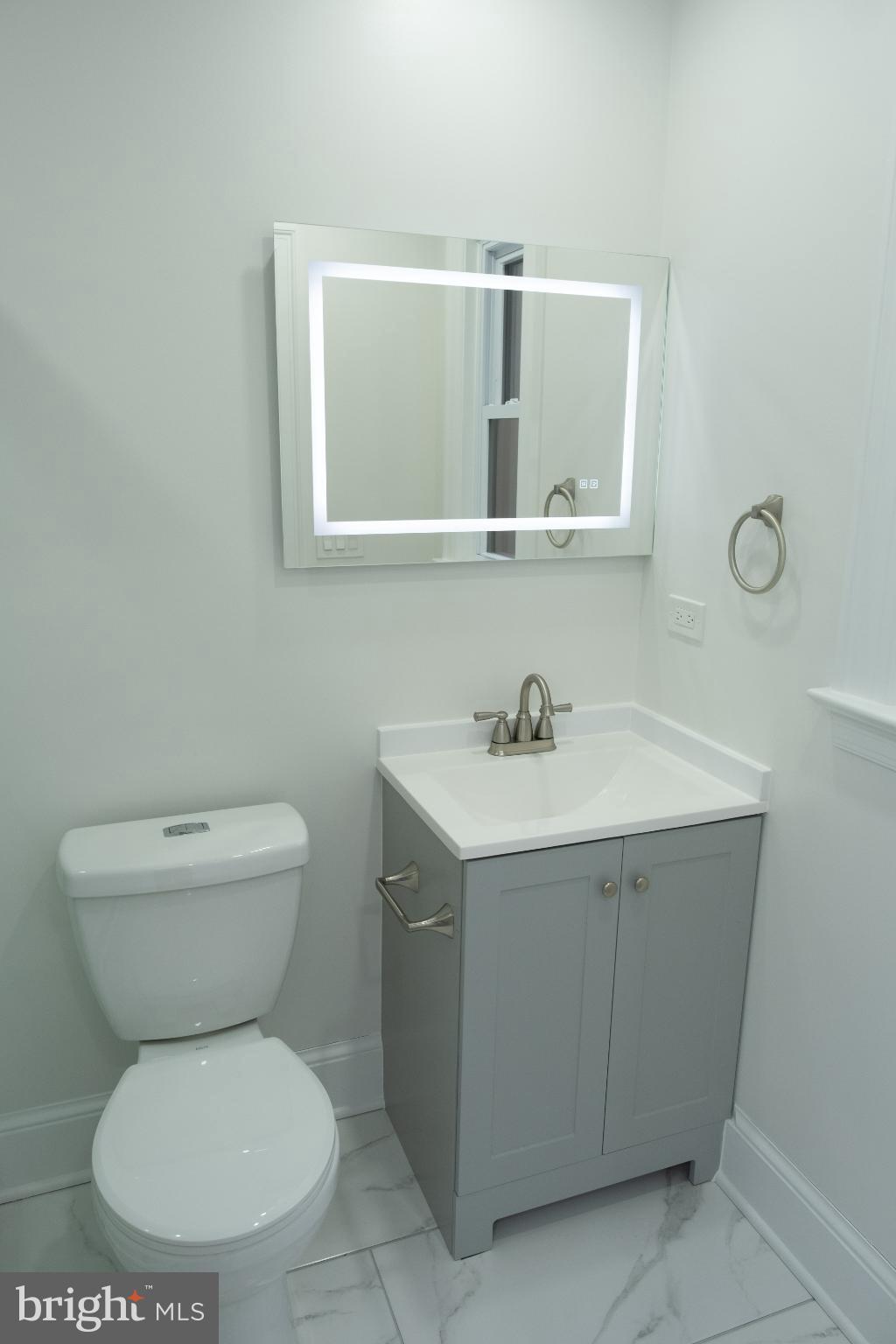 216 Jefferson Street Northwest, Unit A Washington, DC 20011 - Photo 24 of 32 a bathroom with a toilet sink and mirror