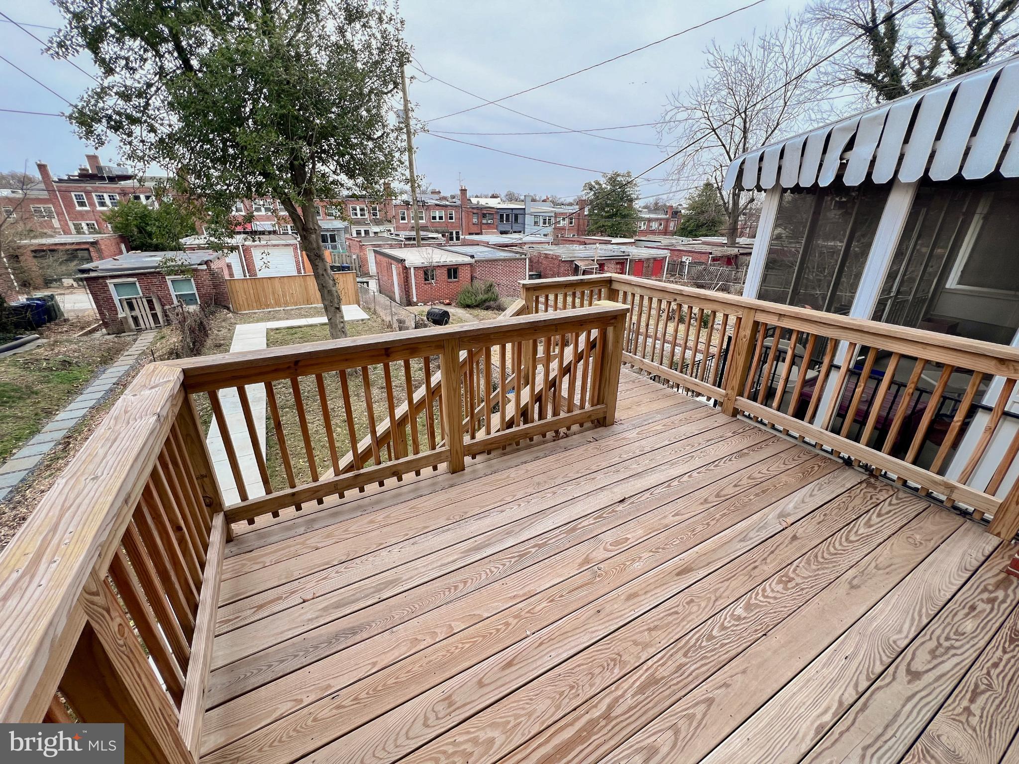 216 Jefferson Street Northwest, Unit A Washington, DC 20011 - Photo 27 of 32 a view of balcony with wooden floor and fence